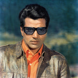 Dharmendra Portrait in a Orange Shirt and Brown Jacket with Gogles- still from the movie “Lalkar” Personal Bollywood Photography of  renowned cinematographer, Shri Prem Sagar. - Sagar World